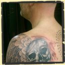 skull with wing trash polka tattoo