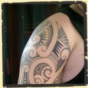 maori inspired arm tattoo