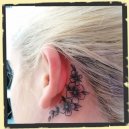 flower tattoo behind ear