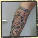 tribal mix tattoo met dotwork